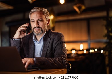 Pensive Adult Man, Helping His Client, While Dining At A Restaurant.