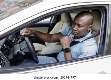 Pensive Black Man Driver Sitting Inside White Car, Stuck In Traffic, Touching His Chin And Looking At Road, Getting Late For Flight Or Business Meeting, Feeling Exhausted Cause Of Summer Heat, Closeup