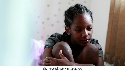 
Pensive Black Teen Girl Child Thinking. Thoughtful Sad Depressed Teenager Adolescent Girl