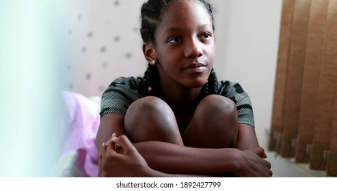 
Pensive Black Teen Girl Child Thinking. Thoughtful Sad Depressed Teenager Adolescent Girl