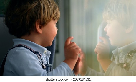 Pensive Child Daydreaming Inside Train Looking Out Wagon Window