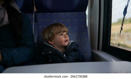 Pensive Child Daydreaming Inside Train Looking Out Wagon Window