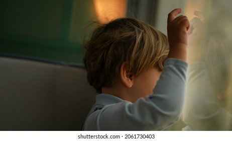 Pensive Child Daydreaming Inside Train Looking Out Wagon Window