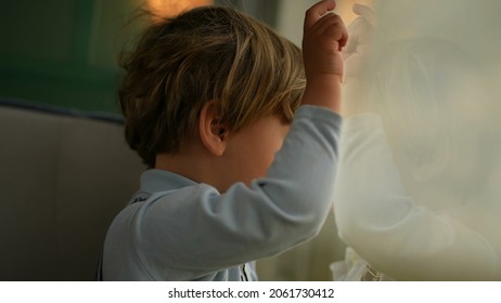 Pensive Child Daydreaming Inside Train Looking Out Wagon Window