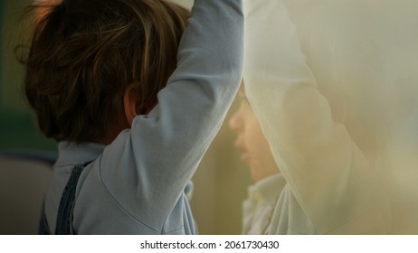 Pensive Child Daydreaming Inside Train Looking Out Wagon Window