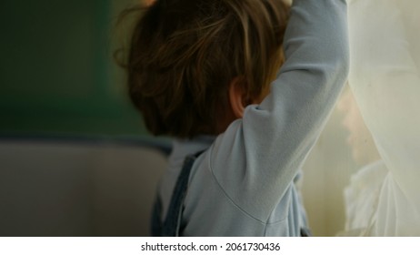 Pensive Child Daydreaming Inside Train Looking Out Wagon Window