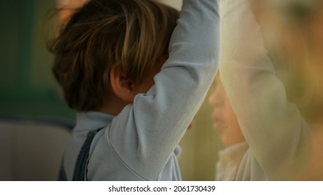 Pensive Child Daydreaming Inside Train Looking Out Wagon Window