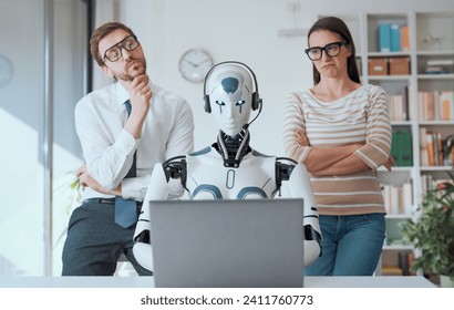 Pensive disappointed business people supervising an AI robot working in the office - Powered by Shutterstock