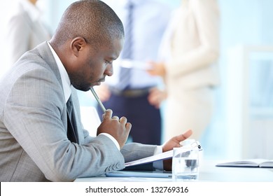 Pensive entrepreneur thinking over financial results - Powered by Shutterstock