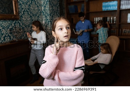 Pensive girl trying to find solution of conundrum to get out of quest room