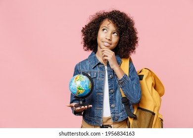 Pensive little african kid school girl 12-13 years old in casual clothes backpack hold in palms Earth world globe prop up chin look aside dream isolated on pink background Childhood education concept - Powered by Shutterstock