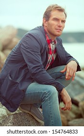 Pensive Man On A Beach