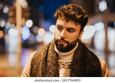 Pensive man in scarf outdoors at night with city lights blurred in the background, evoking urban life and contemplation. - Powered by Shutterstock