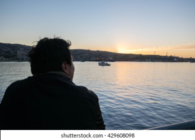 Pensive man thinking looking forward at sunset