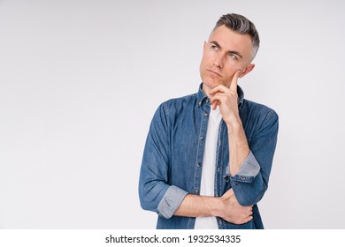 Pensive mature caucasian man in denim shirt isolated in white background - Powered by Shutterstock