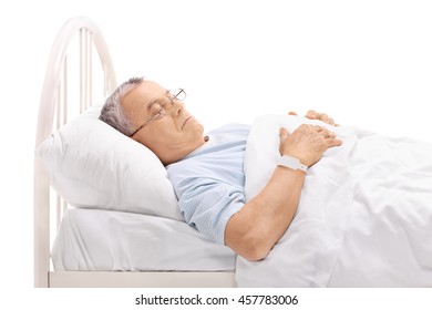 Pensive Mature Patient Laying On A Hospital Bed Isolated On White Background