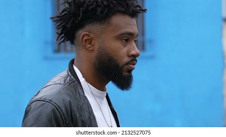 A Pensive Person Walking Outside In Street One Brazilian Man Walks Forward