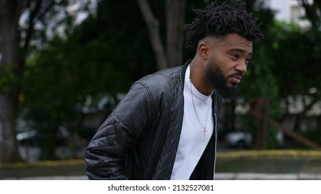 A Pensive Person Walking Outside In Street One Brazilian Man Walks Forward