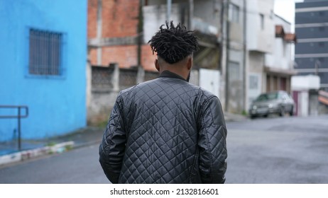 A Pensive Person Walking Outside In Street 