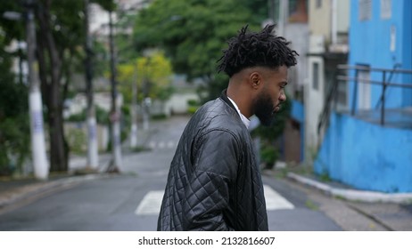 A Pensive Person Walking Outside In Street 