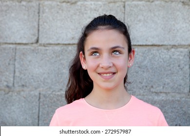 Pensive Preteen Girl With Blue Eyes Outside Thinking