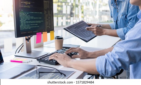 Pensive programmer working on on desktop pc programming code technologies or website design at office Software Development Company.