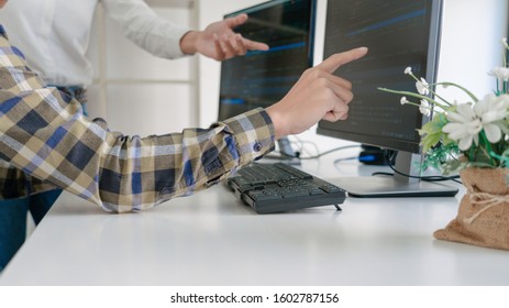 Pensive programmer working on desktop pc programming code technologies or website design at office Software Development Company