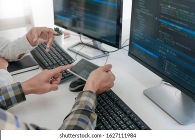Pensive programmer working on desktop pc programming code technologies or website design at office Software Development Company
