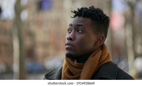 Pensive Thoughtful Black African Man Walking Outside In Winter Season