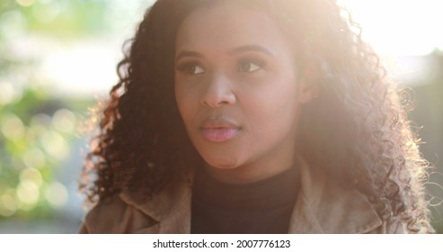 Pensive Thoughtful Black African Woman Thinking Outside Pondering Solution To Problem.