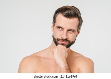 Pensive Thoughtful Thinking Caucasian Young Man Shirtless Naked Taking Care Of His Body Skin Face Isolated In White Background