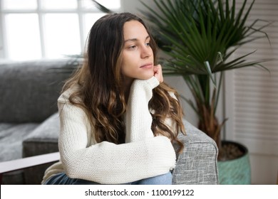 Pensive Thoughtful Young Girl Feeling Lonely Looking Away Lost In Thoughts, Sad Depressed Teenager Spending Time Alone At Home In Silence, Melancholic Meditative Serious Woman Thinking About Problems