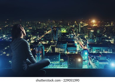 Pensive Woman Is Looking At Night City