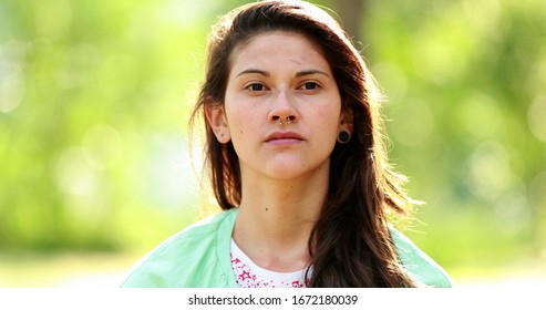 Pensive woman portrait face thinking outdoors. Relaxed thoughtful girl at park - Shutterstock ID 1672180039