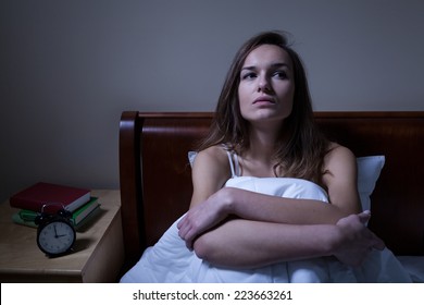 Pensive Woman Stying Sleepless In Bed At Night