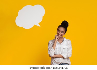 Pensive Young Afro Woman Posing Over Yellow Background With Empty Speach Bubble Above Her Head