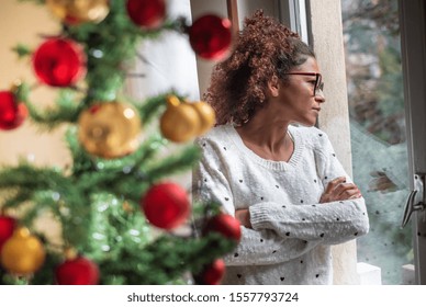 Pensive Young Black Woman Celebrating Christmas Alone