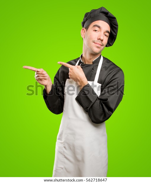 Pensive Young Chef Pointing Stock Photo 562718647 | Shutterstock