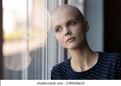 Pensive Young Ill Hairless Female Patient Struggle With Oncology Look In Distance Dream Think, Caucasian Sick Woman With Cancer Feel Lonely At Home, Believe In Future Recovery, Healthcare Concept