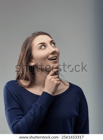 Similar – Image, Stock Photo Young woman gazing upwards in urban setting