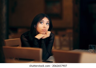 Pensive Young Woman Sitting Alone In A Restaurant. Lonely Party Host Feeling Disappointed And Frustrated 
