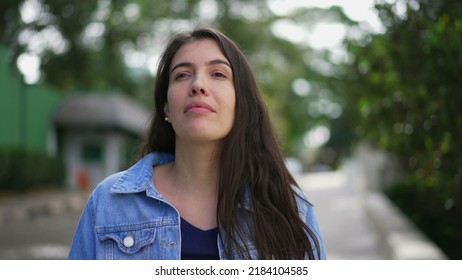 Pensive young woman standing outside. Portrait of contemplative person closeup face - Powered by Shutterstock