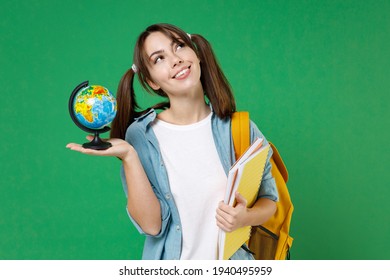 Pensive Young Woman Student In Blue Shirt Backpack Hold Notebooks Earth World Globe Looking Up Isolated On Green Color Background Studio Portrait. Education In High School University College Concept