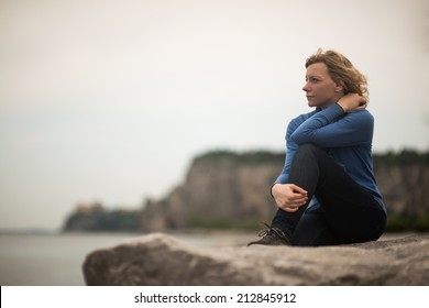 Pensive/dreaming Woman On The Beach