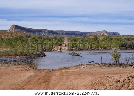 Pentecost river crossing with the orange cliffs of the Cockburn Range in the Kimberleys, Western Australia