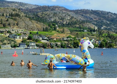 Penticton, British Columbia, Canada - July 1, 2022: Tourist On The Beach Of Skaha Lake During Canada Day And Summer Fun, Located In The Okanagan Valley In Penticton, British Columbia, Canada.