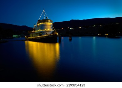 Penticton, British Columbia, Canada – July 20, 2019. Penticton Tugboat Night Okanagan Lake. The CN No. 6 Tugboat, Moored Just Offshore On Lake Okanagan, Is One Of The Vessels In The Inland Marine Heri