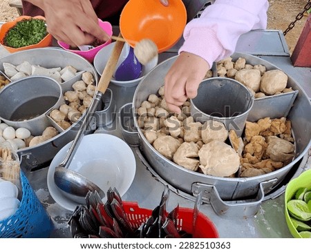 Pentol or meatballs or pentol bakso is an Indonesian street food made from beef or chicken. Pentol (meatball) hawker food that is not boring, tasty and delicious. Foto d'archivio © 