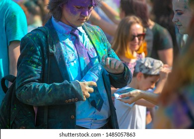 Penza. Russia. 06. 08. 2019. young man sprinkled with multi-colored powder at the Festival of colors. - Shutterstock ID 1485057863