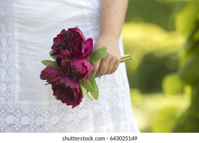 Peonies in hand